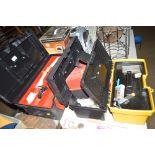 Four plastic tool boxes and contents