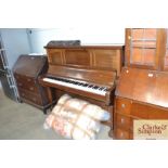 A Burling & Mansfield upright piano