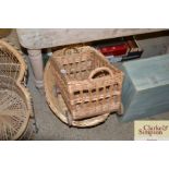 An oval wicker laundry basket and a small basket o