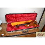 A violin in fitted case, bearing label for J T L G