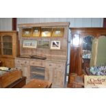 A large antique stripped pine dresser