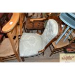 A Victorian walnut spoon back nursing chair