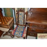 A Victorian walnut nursing chair with embroidered