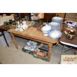 A stripped pine topped extending dining table