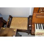 A mahogany piano stool on cabriole supports
