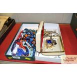 Two boxes containing various costume jewellery; a