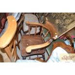 An elm seated smokers bow elbow chair