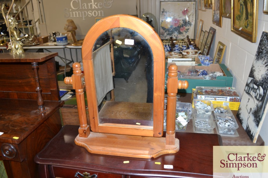 A pine framed swing toilet mirror