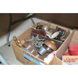 A box of various metal ware