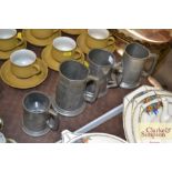 Four various pewter tankards