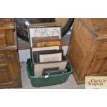 A box containing miscellaneous pictures, prints, e