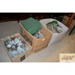 A box of various pottery plates and dishes; table