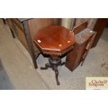 A Victorian walnut trumpet shaped sewing table