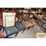 A set of four Edwardian carved mahogany dining cha