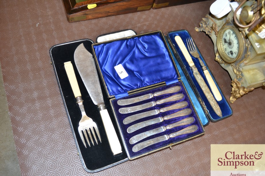 A cased set of silver handled butter knives; and o