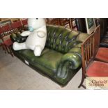 A green buttoned leather Chesterfield style three