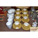A Denby buff colour set of eight coffee cups and s