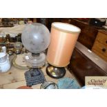 A Victorian glass oil lamp on cast iron base; and