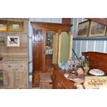 An Edwardian inlaid mahogany mirror door wardrobe