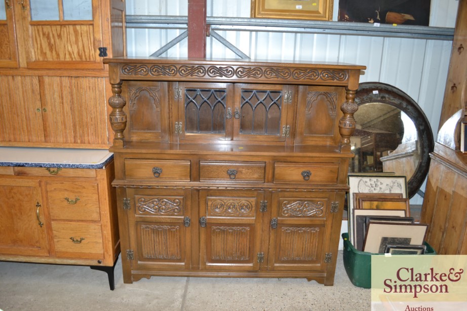 A reproduction oak court cupboard