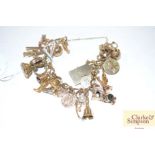 A 9ct gold charm bracelet set with various 9crt a