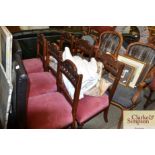 A set of six Edwardian carved dining chairs with r
