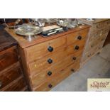 An antique stripped pine chest of two short over t
