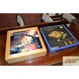 A wooden games compendium and a Schach magnetic ch