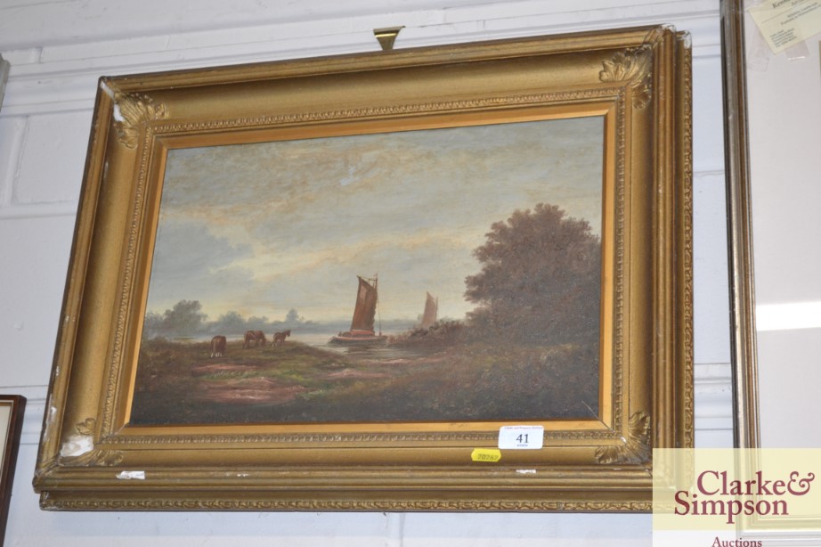 A gilt framed oil on board study depicting barges;