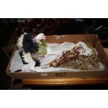 A box of artificial flowers and glass beadwork flo