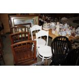 A pair of white painted bentwood chairs; together