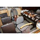 Two grey upholstered swivel office chairs