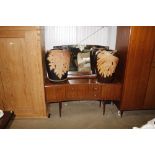 A mirrored teak dressing table