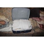 A suitcase of various linen