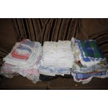 Three bundles of various material; towels etc.