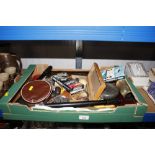 A box containing various vintage items to include