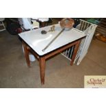 An enamel top kitchen table fitted single end draw