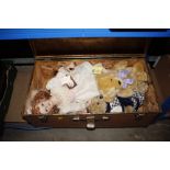 A storage trunk and contents of dolls and soft toy