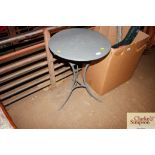 A grey painted folding metal table