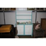 A painted dresser raised on cupboard base fitted w