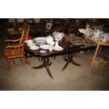 A reproduction mahogany D end extending table with