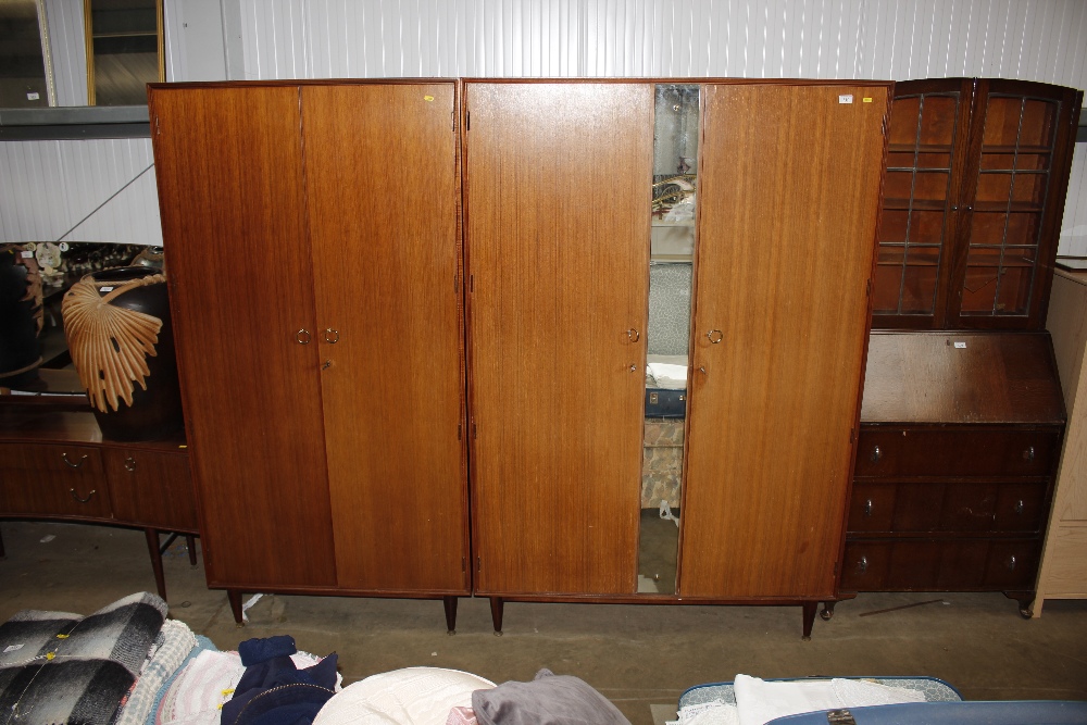 Two mirrored teak wardrobes