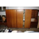 Two mirrored teak wardrobes