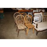 Four elm seated stick back chairs