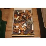 A box containing carved wooden animals etc