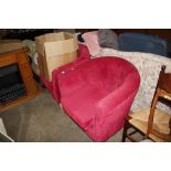 A pair of red upholstered tub chairs