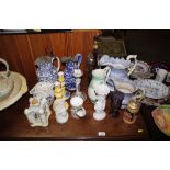 A quantity of various jugs, candlesticks, teapot,