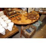 A circular pine pedestal kitchen table