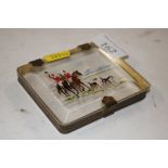 A small cigarette case decorated with a hunting sc