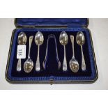 A cased set of six silver teaspoons and matching s